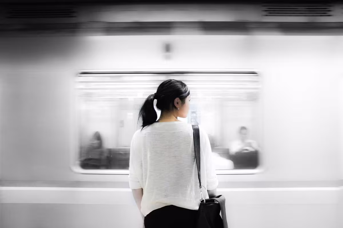 AI Consultant Company Employee waiting for train